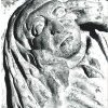 La crypte : tête de personnage sur un chapiteau